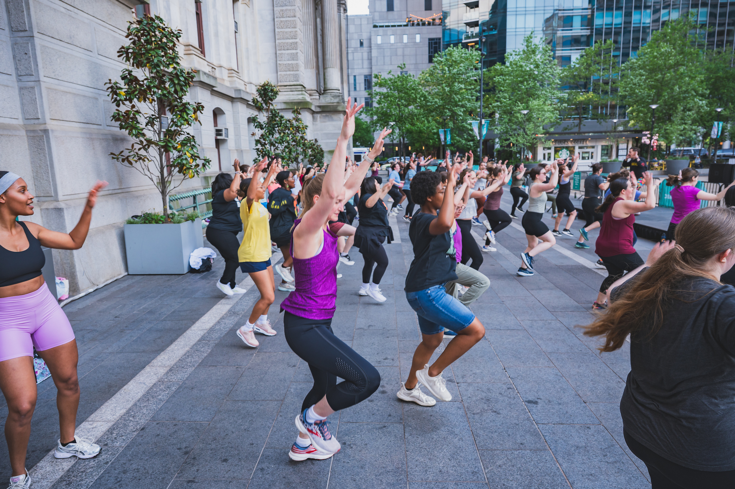 Group of people exercising in a Zumba class at Dilworth Park