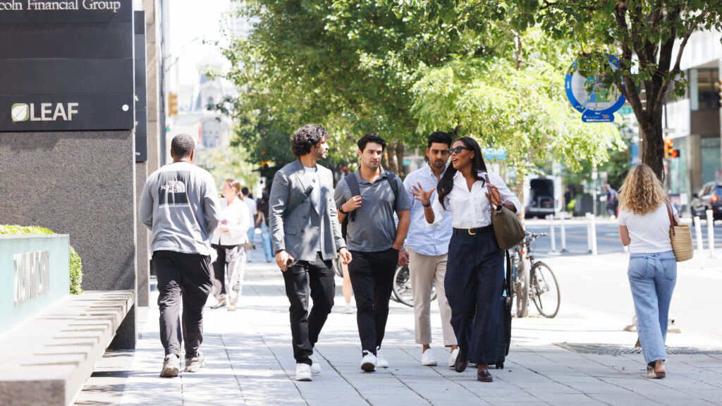 Young professionals walking in the office district.