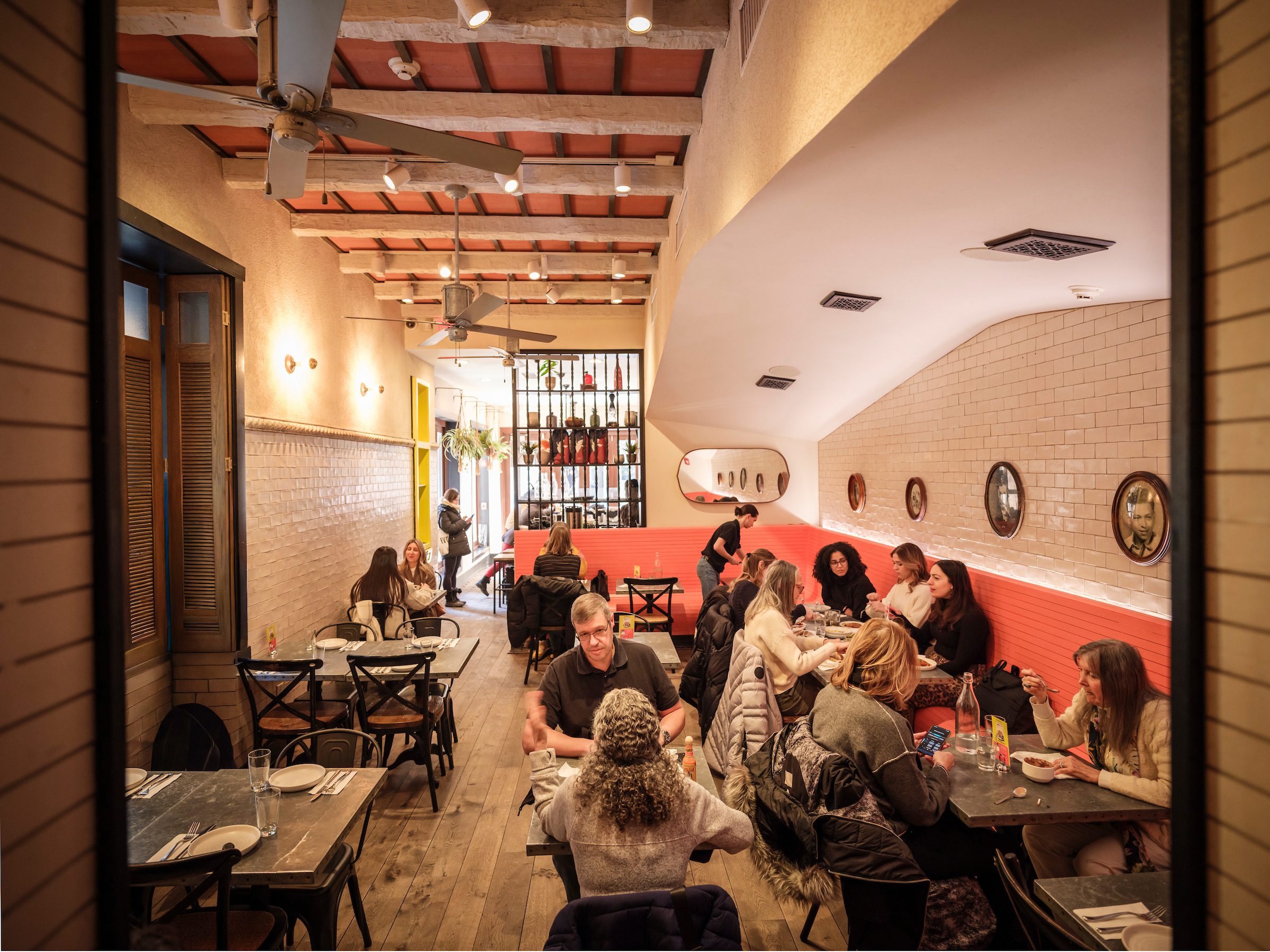 people eating inside of bar bombon
